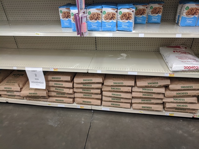 The shelves at Broulim's - a few bags of all purpose flour remain, and a ton of large 25 lb bags remain on the bottom shelf.