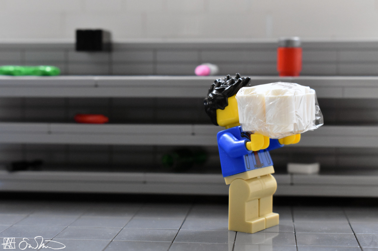 A lego person taking the last package of toilet paper from a store shelf.  Source: https://legogradstudent.tumblr.com/post/613037524918648832/grabbing-a-pack-of-toilet-paper-the-grad-student