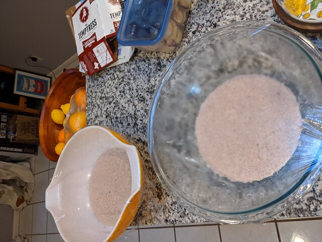 Dough in a bowl, only taking up a small amount of the bowl